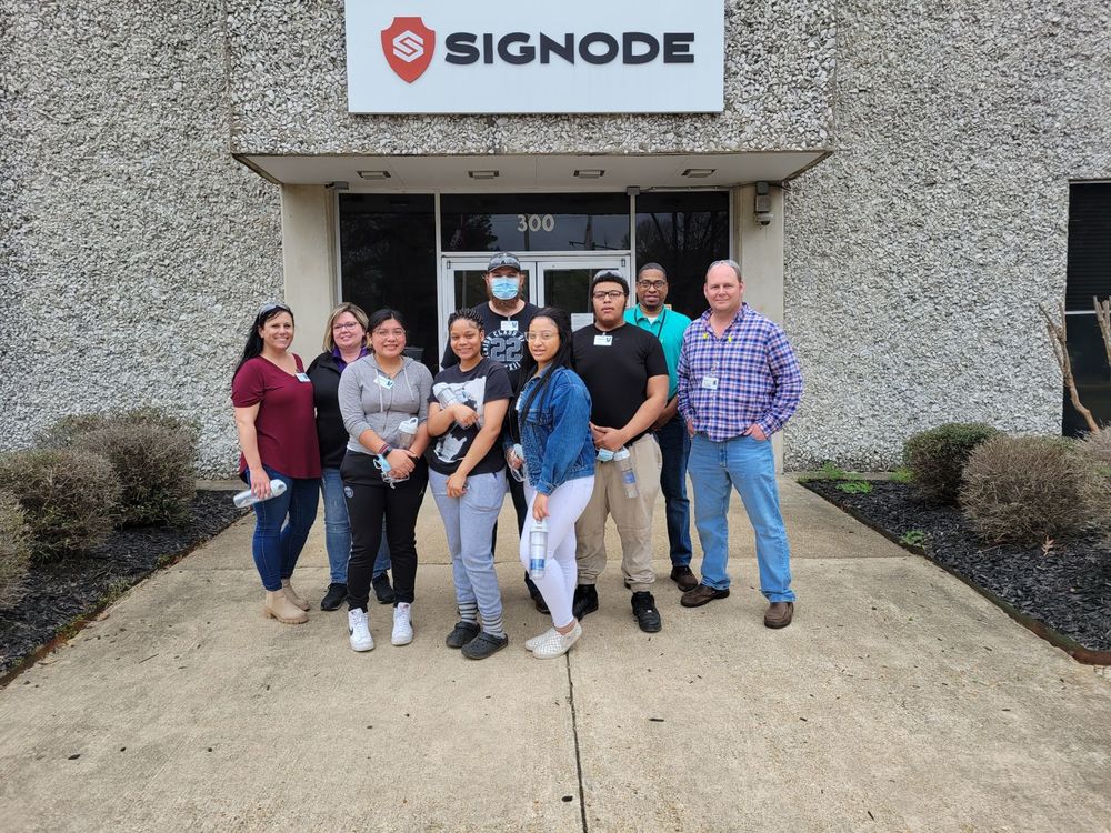 students in front on signode business entrance 